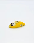 Resin-crafted Cat & Banana incense holder featuring a white cat nestled inside a peeled yellow banana, shown on a clean white background.