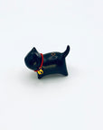 Cat & Bell incense holder with red collar and gold bell on a clean white background.