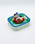 Cat and koi incense holder placed inside the Purrfect Ash Tub for ash collection.