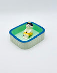 Cat & Towel incense holder placed inside the Purrfect Ash Tub, displayed within the mint-green and blue-rimmed tray.