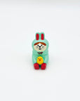 A front view of the bunny-and-chick resin incense holder, featuring hand-painted details and a cute, gentle expression.