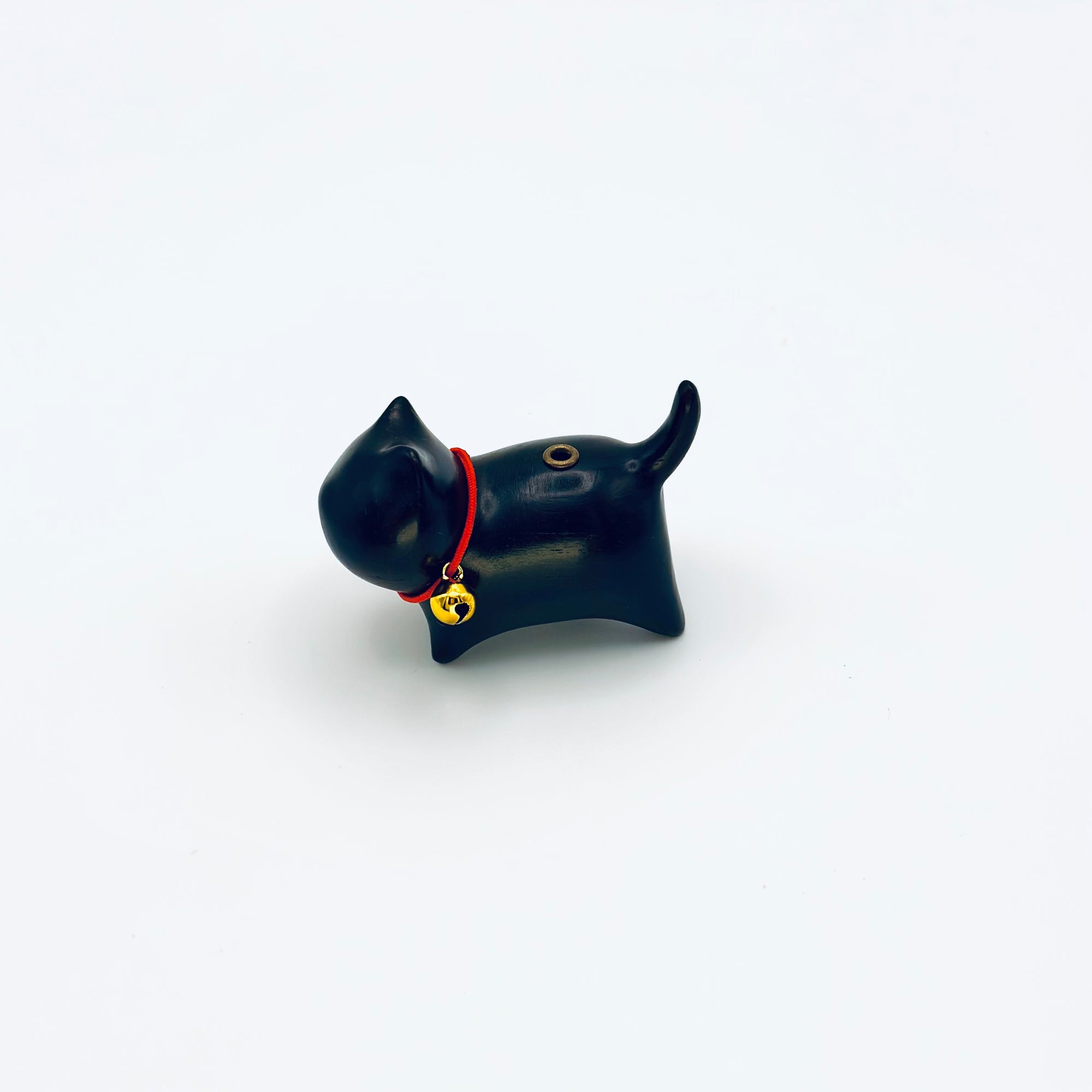 Cat & Bell incense holder with red collar and gold bell on a clean white background.