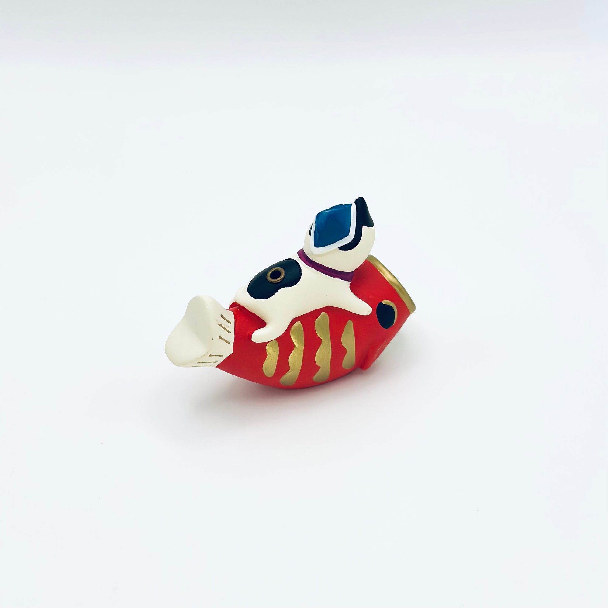 Back and side view of the cat and koi incense holder, highlighting the sculpted details and painted patterns.