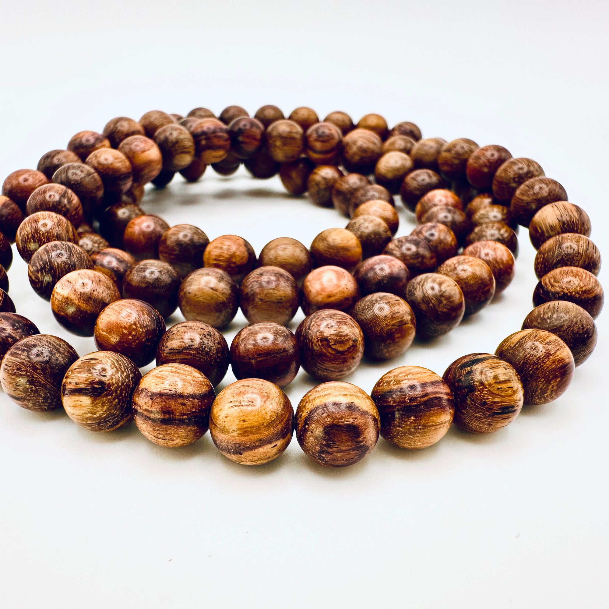 Close-up of Huanghuali Bead Bracelet (small) highlighting the intricate wood grain textures and polished natural finish