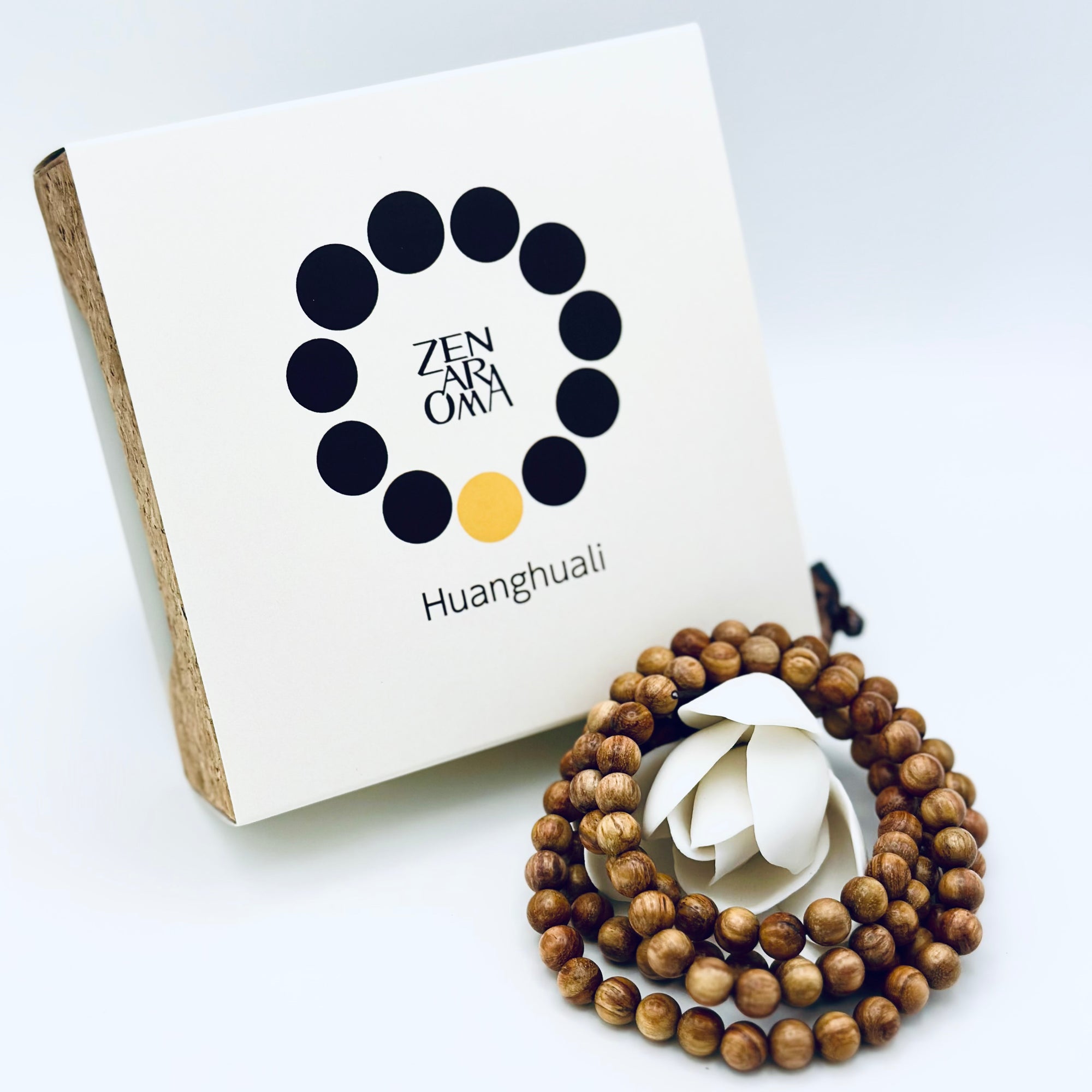 ZA Studio Huanghuali Bead Bracelet (small) displayed with its signature box, showcasing natural grain patterns and warm golden-brown hues.