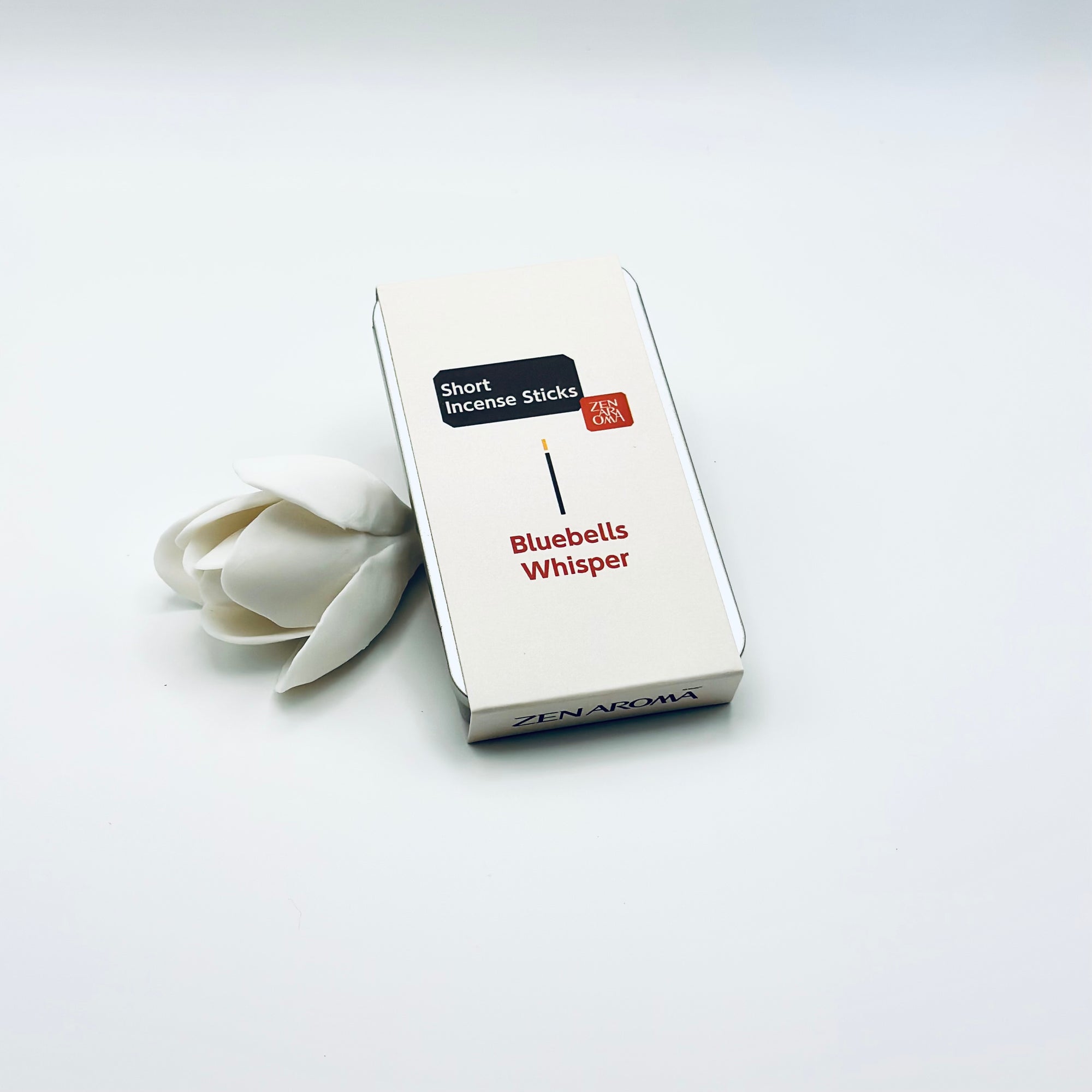 Zen Aroma Bluebells Whisper To-Go Incense Kit in beige metal box, styled with a white flower on a clean white background, showcasing minimalist packaging design.
