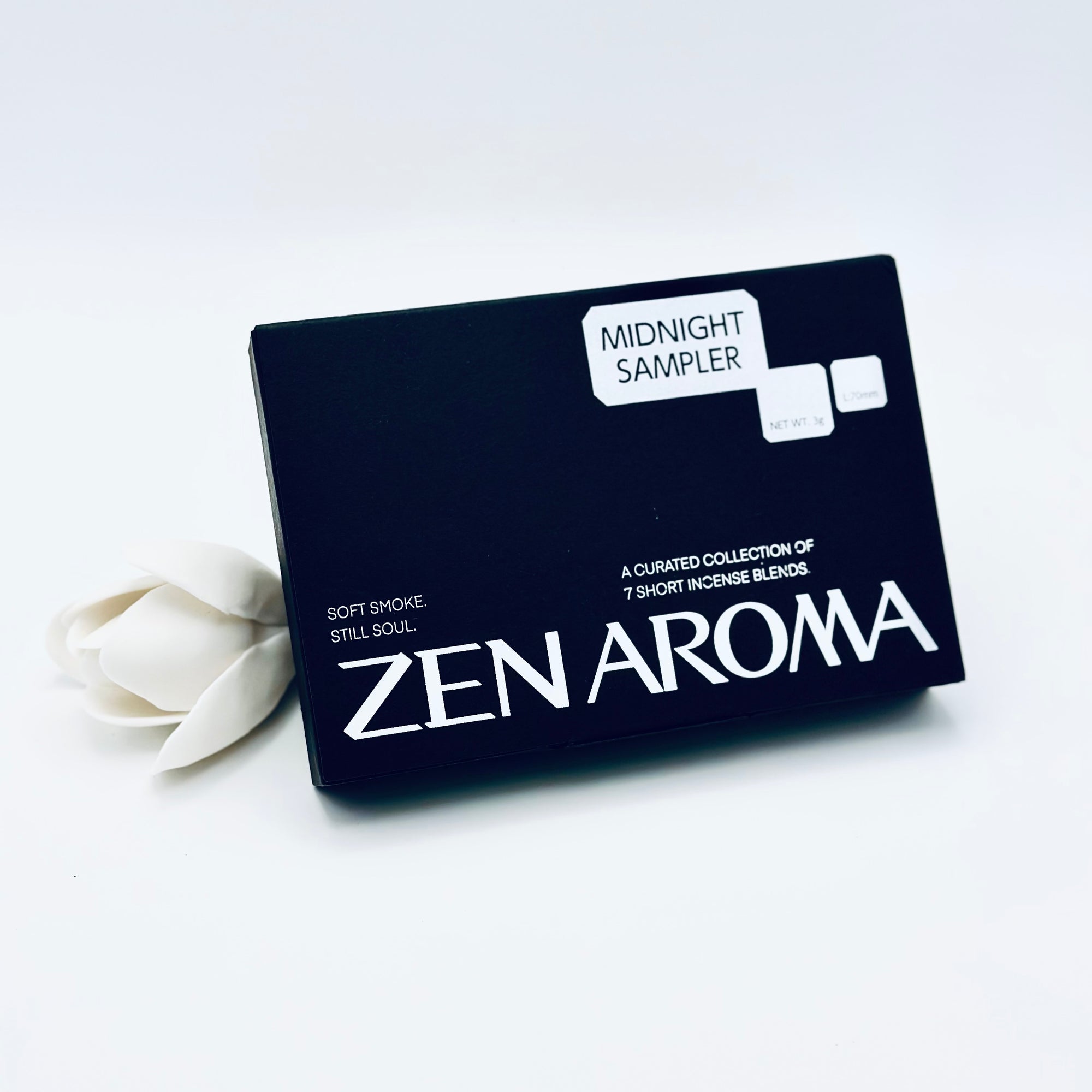 Zen Aroma “Midnight Sampler” box set featuring a curated collection of seven short incense blends, styled with a white flower on a minimal white background.