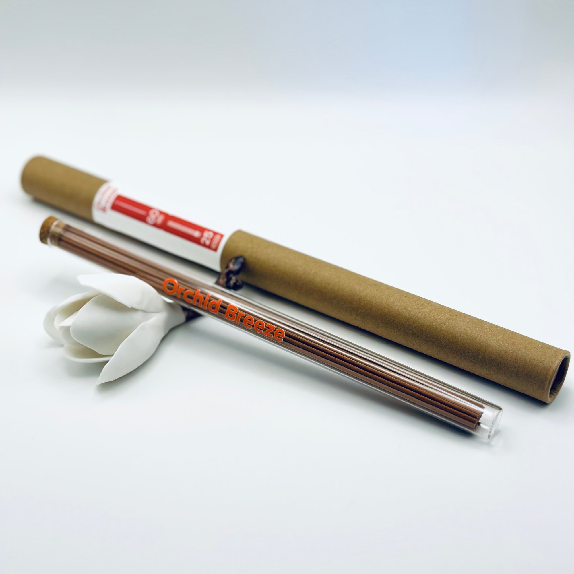 Zen Aroma Orchid Breeze incense sticks in a glass tube with cork and brown cardboard tube packaging, displayed on a clean white background.