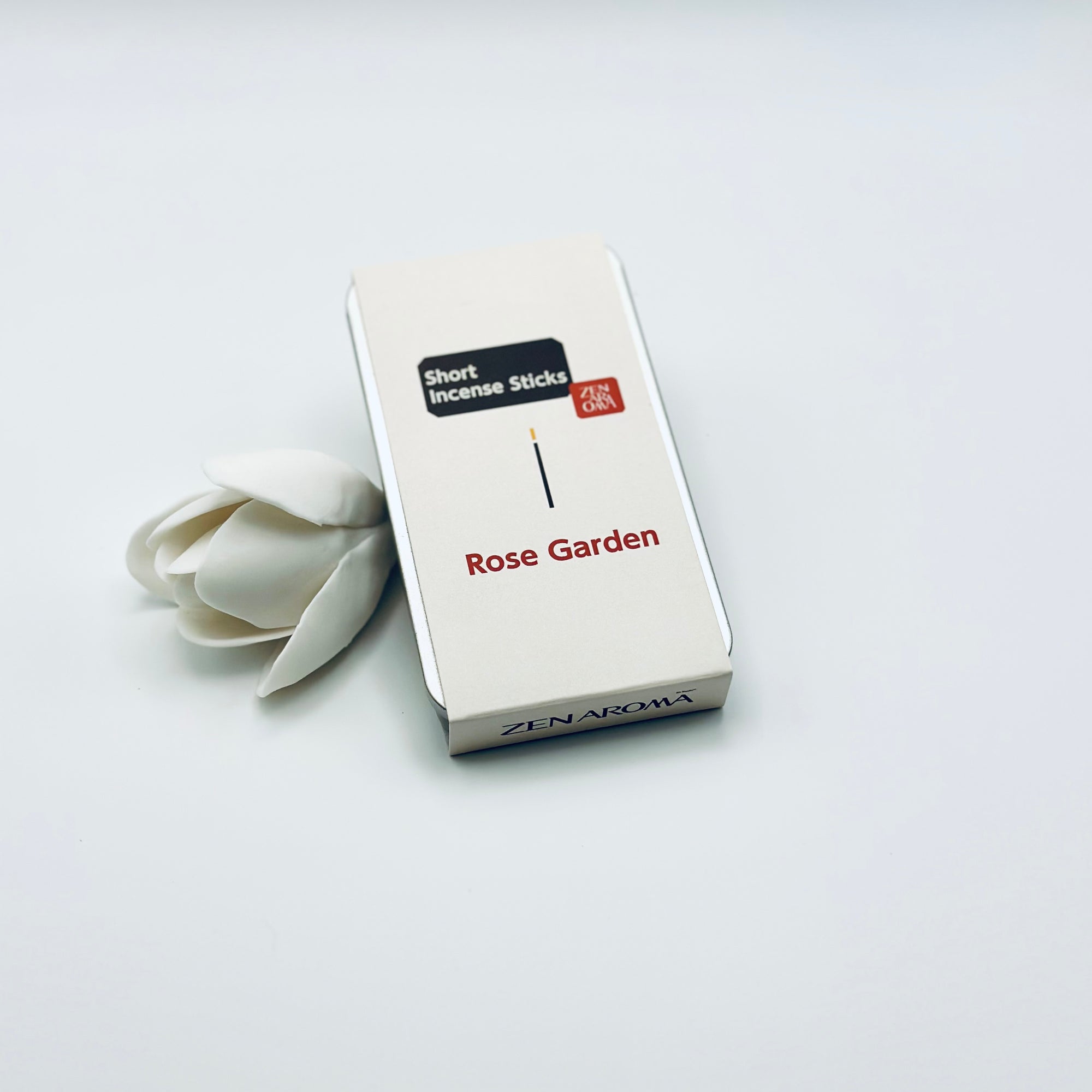 Zen Aroma Rose Garden To-Go Incense Kit in beige metal box, styled with a white flower on a clean white background, showcasing minimalist packaging design.