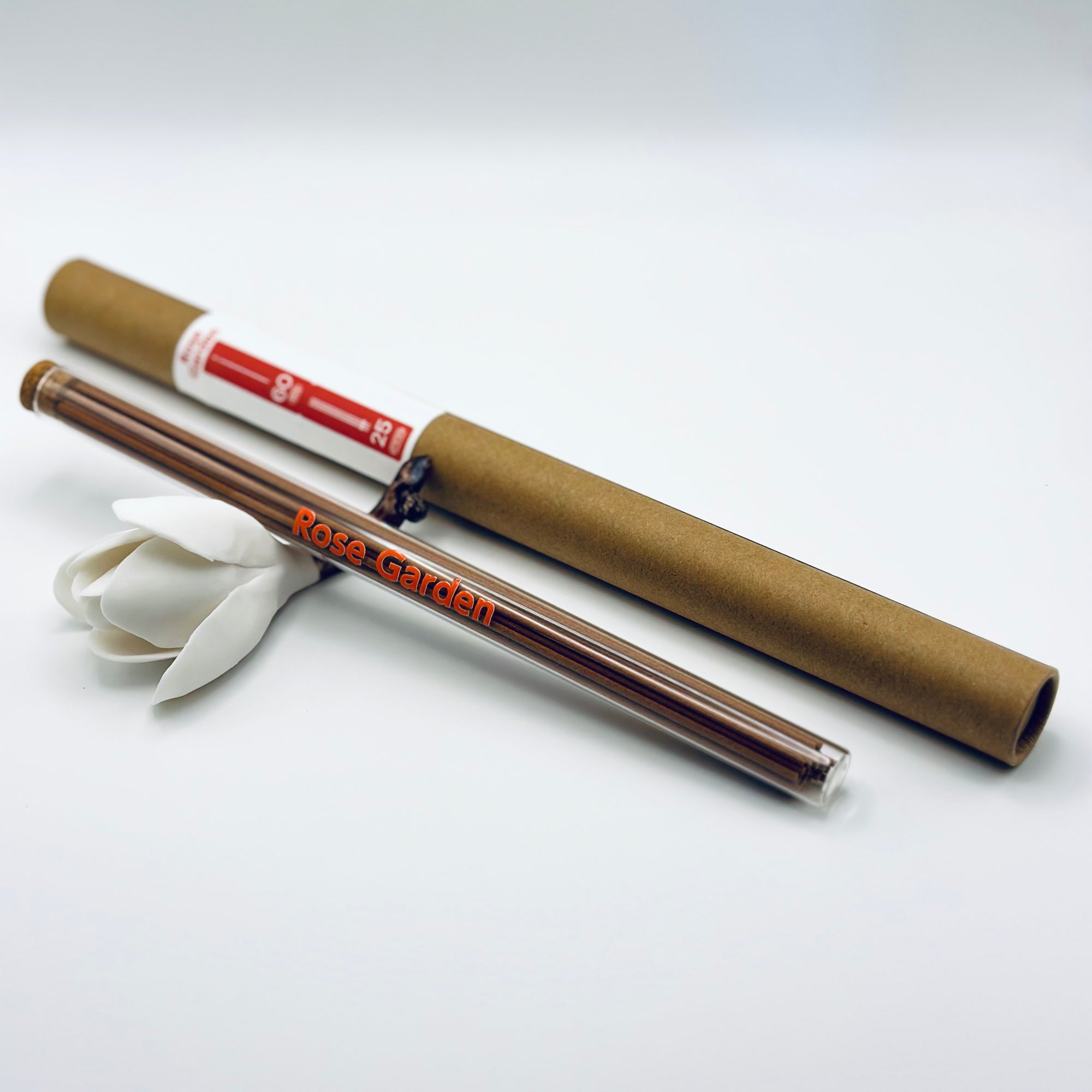 Zen Aroma Rose Garden incense sticks in a glass tube with cork and brown cardboard tube packaging, displayed on a clean white background.