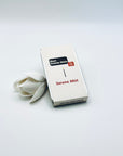 Zen Aroma Serene Mist To-Go Incense Kit in beige metal box, styled with a white flower on a clean white background, showcasing minimalist packaging design.