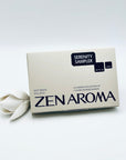 Zen Aroma “Serenity Sampler” box featuring a curated collection of seven short incense blends, styled with a white flower on a soft white background to evoke calm and tranquility.