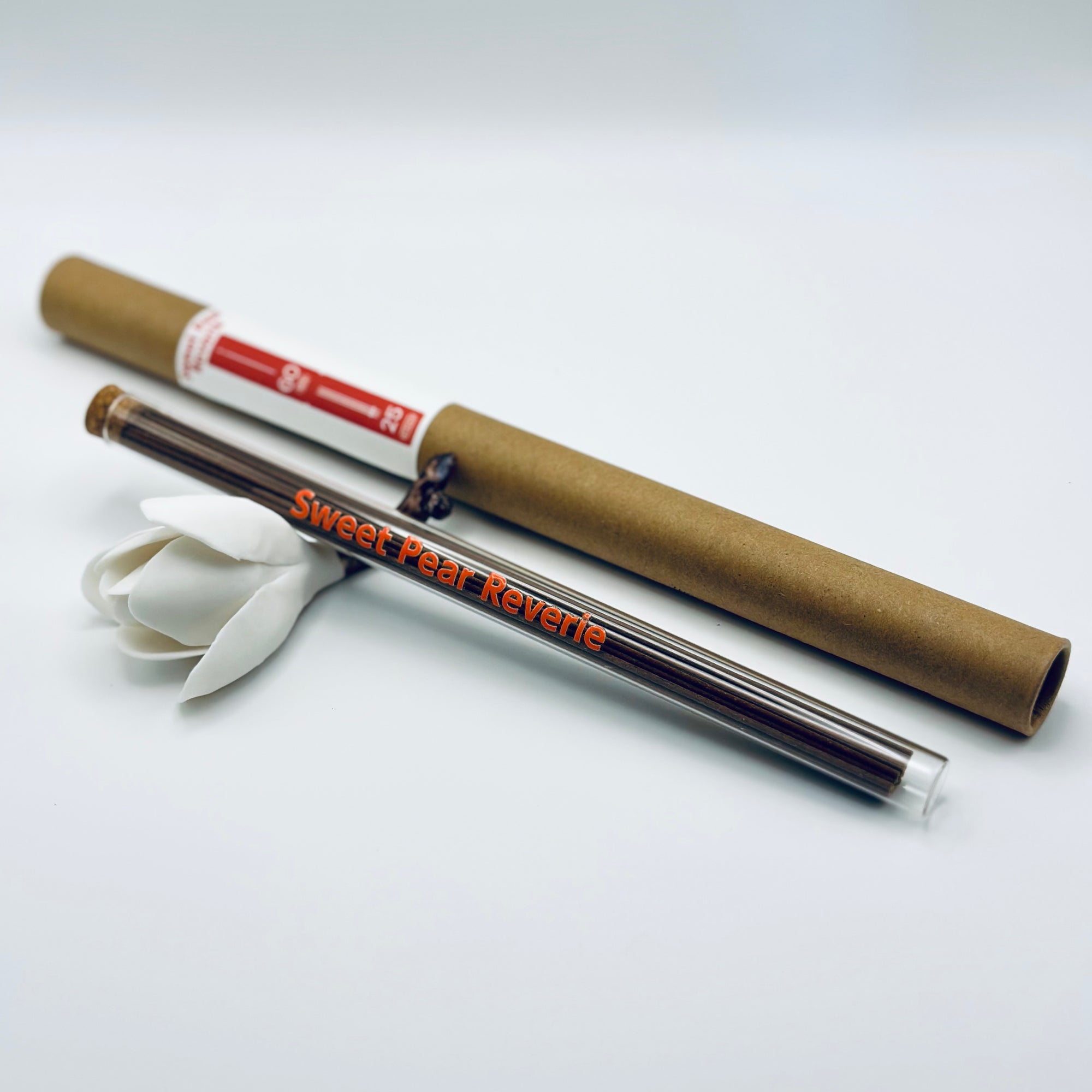 Zen Aroma Sweet Pear Reverie incense sticks in a glass tube with cork and brown cardboard tube packaging, displayed on a clean white background.