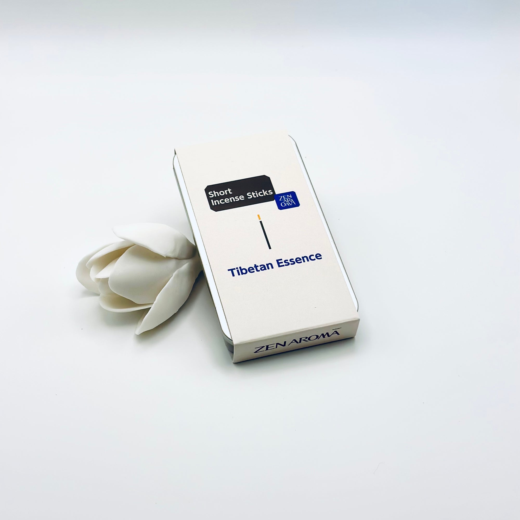 Zen Aroma Tibetan Essence To-Go Incense Kit in beige metal box, featuring minimalist packaging with white flower accent on a soft white background.