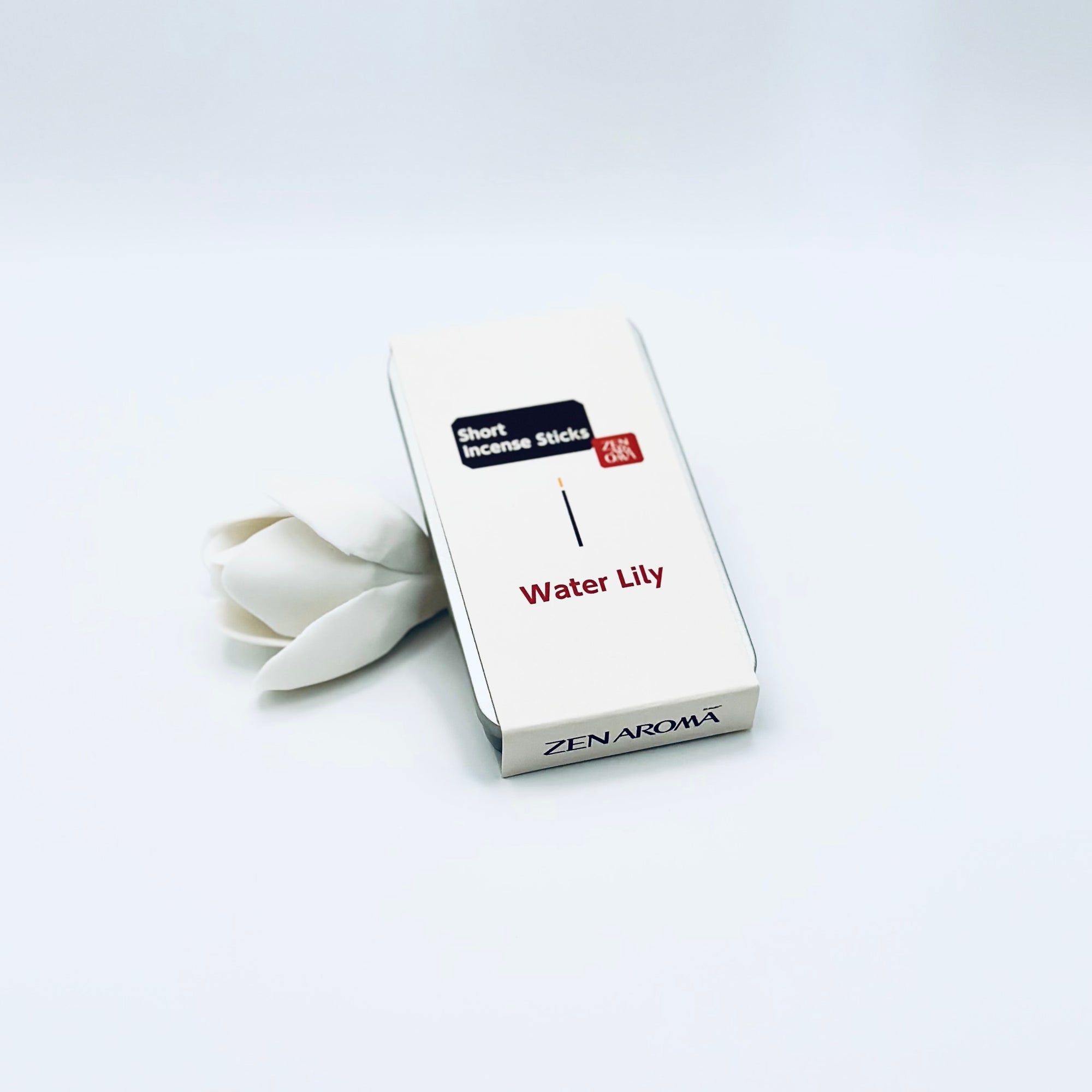 Zen Aroma Water Lily To-Go Incense Kit in beige metal box, styled with a white flower on a clean white background, showcasing minimalist packaging design.