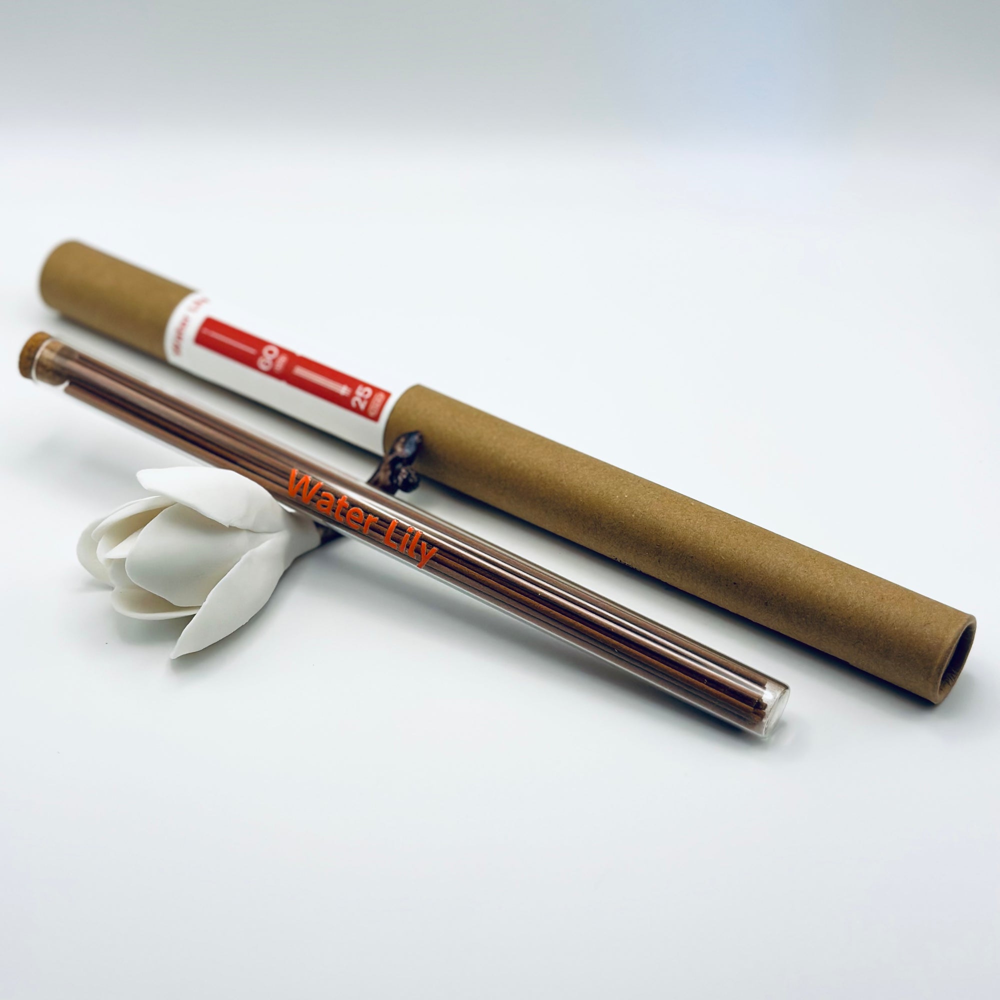 Zen Aroma Water Lily incense sticks in a glass tube with cork and brown cardboard tube packaging, displayed on a clean white background.